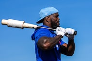 Texas Rangers outfielder Adolis García prepares for batting practice during a spring...