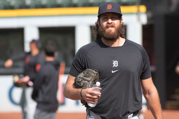 Detroit Tigers relief pitcher Jason Foley walks from the field during a baseball workout in Cleveland, Friday, Oct. 11, 2024, in preparation for Saturday's Game 5 of the American League Division Series against the Cleveland Guardians. (AP Photo/Phil Long)