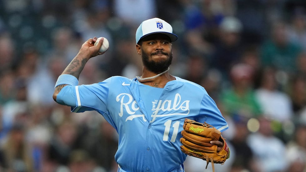 Kansas City Royals third baseman Maikel Garcia makes a throw to first base against the Seattle...
