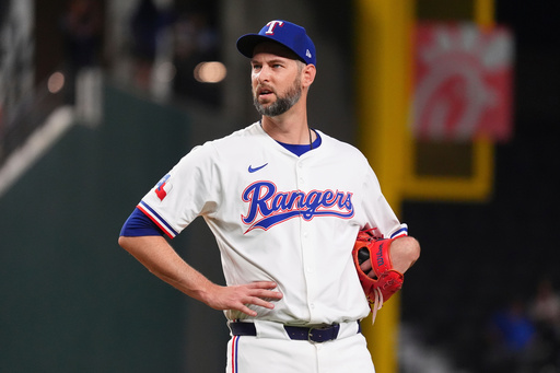 FILE - Texas Rangers pitcher Chris Martin stands on the mound just before leaving a baseball game against the Colorado Rockies, May 13, 2025, in Arlington, Texas. (AP Photo/LM Otero, File)