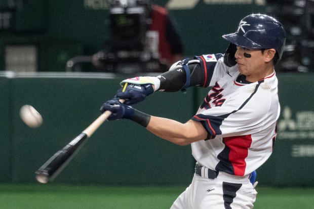 South Korea's Lee Jung-hoo hits a fly ball during the World Baseball Classic (WBC) Pool B round game between Australia and South Korea at the Tokyo Dome in Tokyo on March 9, 2023. (Photo by Richard A. Brooks / AFP) (Photo by RICHARD A. BROOKS/AFP via Getty Images)