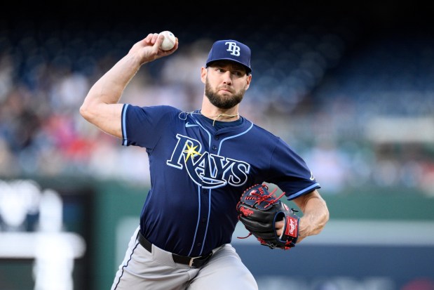 Tampa Bay Rays starting pitcher Adrian Houser throws during the first inning of a baseball game against the Washington Nationals, Friday, Aug. 29, 2025, in Washington. (AP Photo/Nick Wass)