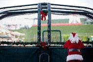 Dressed as Santa Claus for the annual Christmas in June event, Los Angeles Angels chairman...