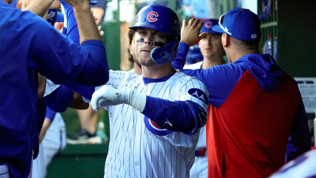 Chicago Cubs infielder Nico Hoerner (2) celebrates with teammates after hitting a single sacrifice fly in the eighth inning against the San Diego Padres during game one of the Wildcard round for the 2025 MLB playoffs at Wrigley Field.