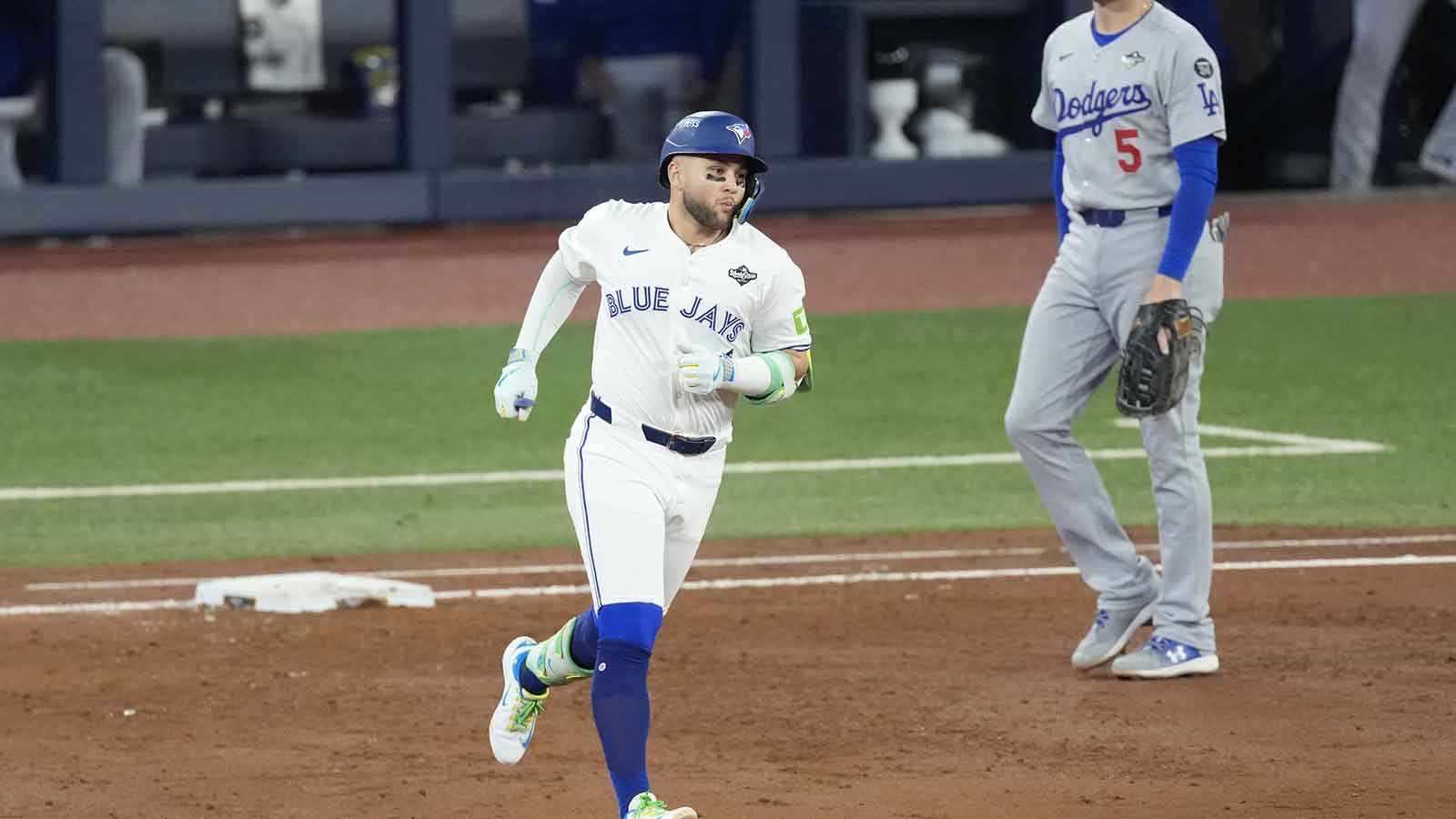 Toronto Blue Jays designated hitter Bo Bichette (11) runs the bases after hitting a three run home run against the Los Angeles Dodgers in the third inning during game seven of the 2025 MLB World Series at Rogers Centre.
