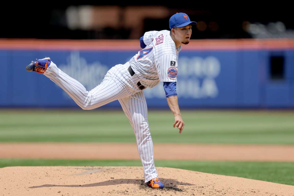 Kodai Senga Mets: Man in white baseball uniform delivers pitch off mound