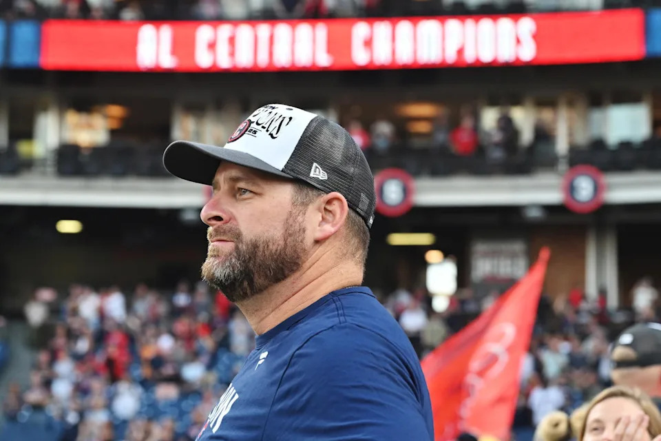 Sep 28, 2025; Cleveland, Ohio, USA; Cleveland Guardians manager Stephen Vogt (12) watches the flag raising after the Guardians beat the Texas Rangers and won the American League Central Division at Progressive Field. Mandatory Credit: Ken Blaze-Imagn Images