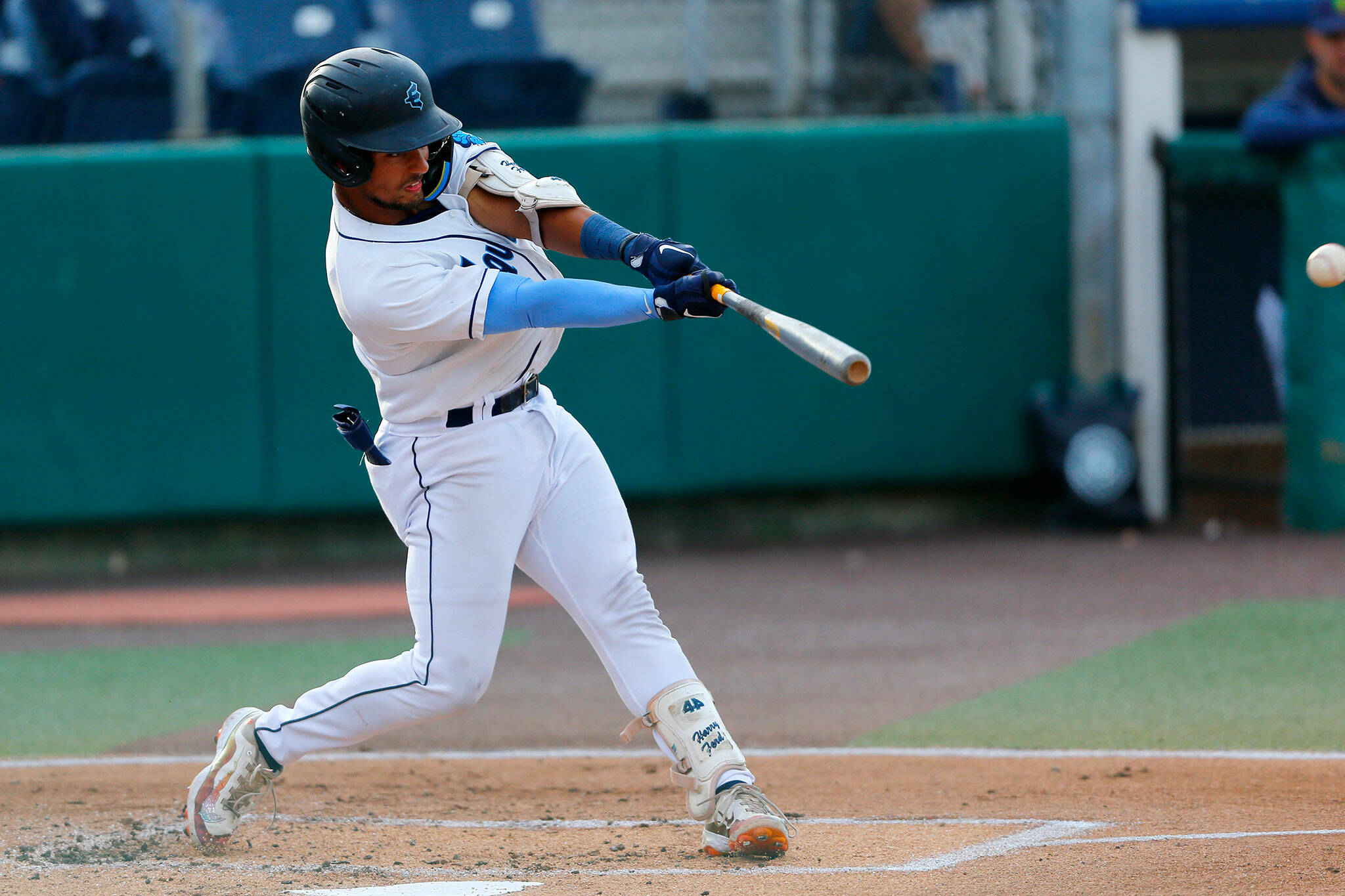 AquaSox catcher Harry Ford hits a fly ball during a game against the Vancouver Canadians on Thursday, June 8, 2023, at Funko Field in Everett, Washington. (Ryan Berry / The Herald)