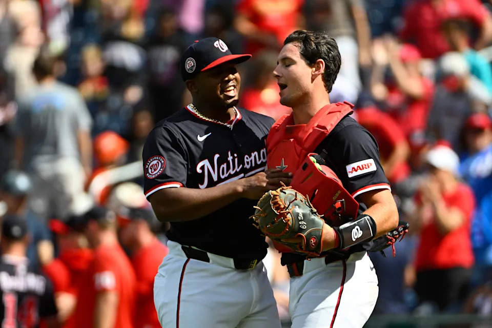 Sep 1, 2025; Washington, District of Columbia, USA; Washington Nationals relief pitcher Jose Ferrer (left) and catcher CJ Stubbs (36) celebrate after the game against the Miami Marlins at Nationals Park. Mandatory Credit: Brad Mills-Imagn Images