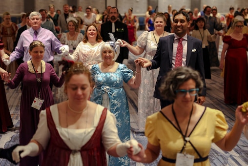 Members of the Jane Austen Society dance at the ball held during the 250th birthday celebration for Jane Austen on Saturday night at the Baltimore Marriot Waterfront.