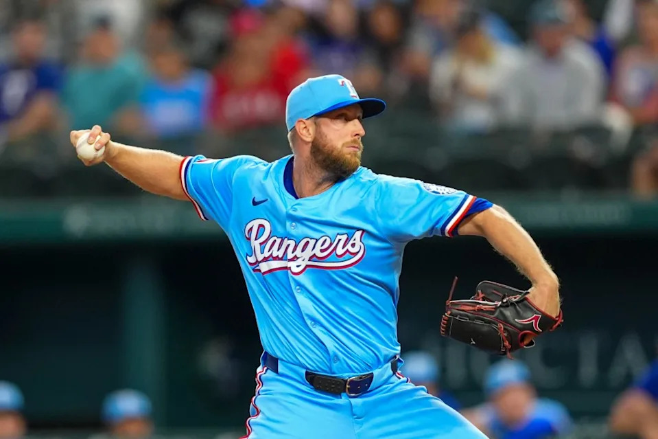 Texas Rangers starting pitcher Merrill Kelly throws a pitch during the first inning of a baseball game against the Miami Marlins on Sunday, Sept. 21, 2025, in Arlington, Texas. AP