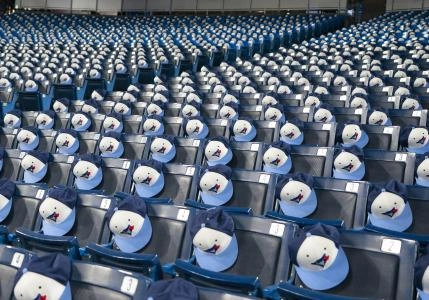 Apr 8, 2022; Toronto, Ontario, CAN; Souvenir baseball caps rest on the seats before the home opener between Toronto Blue Jays and Texas Rangers at Rogers Centre . Mandatory Credit: Nick Turchiaro-Imagn Images