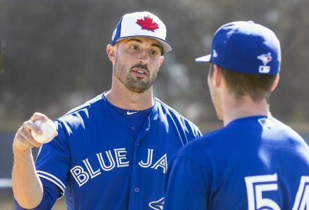 Matt Buschmann demonstrating a grip on a baseball during a Spring Training coaching session Matt Buschmann demonstrating a grip on a baseball during a Spring Training coaching session