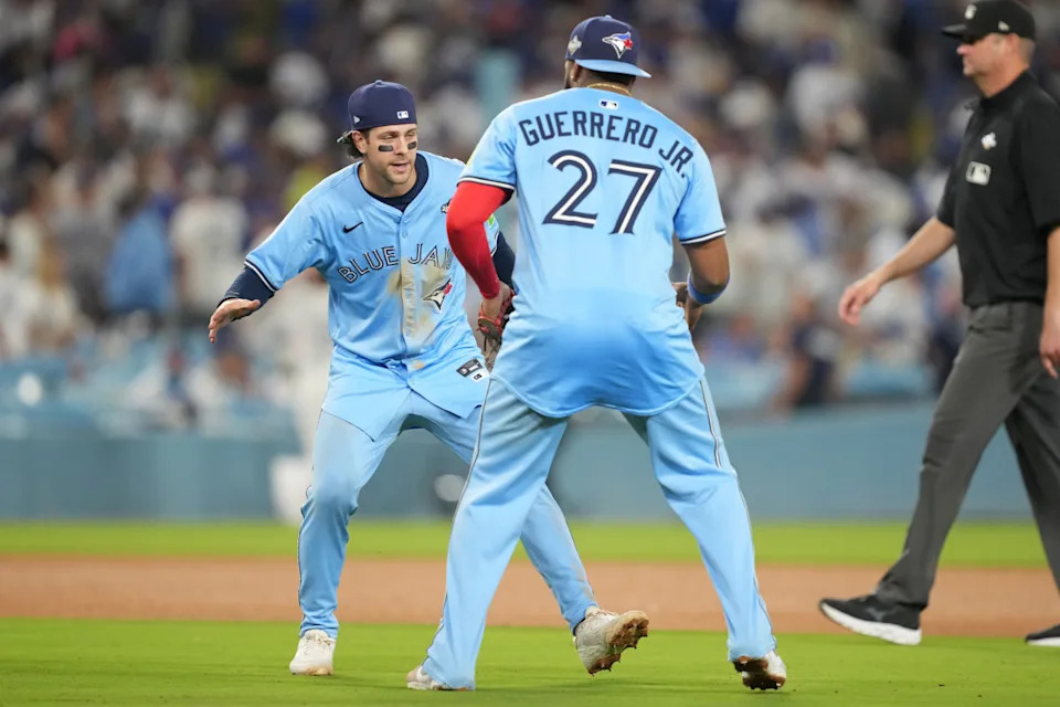 Toronto Blue Jays first baseman Vladimir Guerrero Jr. (27) celebrates with third baseman Ernie Clement (22)© Kirby Lee-Imagn Images