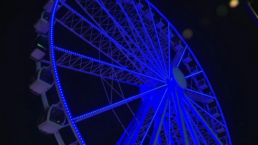 Ferris wheel lights up blue
