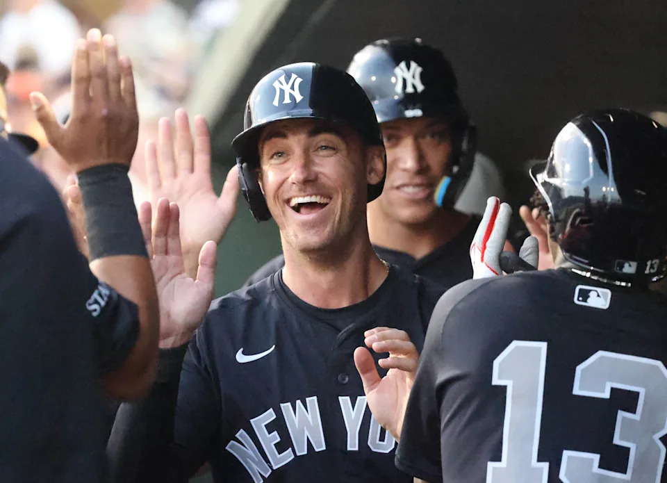 Mar 20, 2025; Sarasota, Florida, USA; New York Yankees outfielder Cody Bellinger (35), New York Yankees third base Jazz Chisholm Jr. (13) and New York Yankees outfielder Aaron Judge (99) high five after scoring during the third inning against the Baltimore Orioles at Ed Smith Stadium. Mandatory Credit: Kim Klement Neitzel-Imagn Images