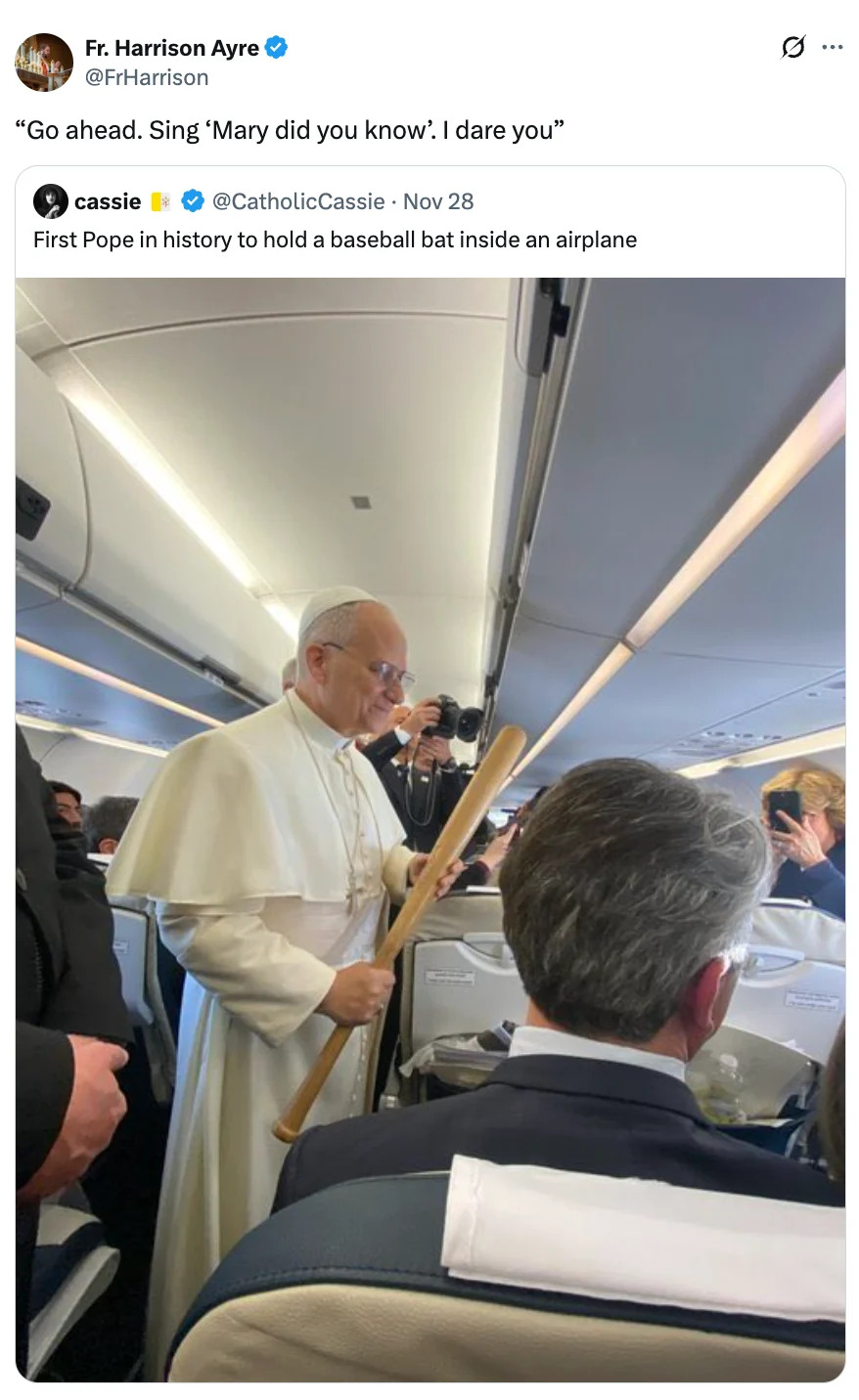 Pope holding a baseball bat inside an airplane, surrounded by passengers and crew, in a humorous context