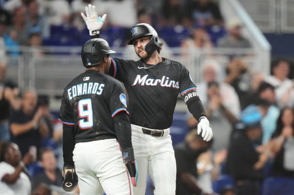 Connor Norby and Xavier Edwards celebrating after Norby's two-run home run.