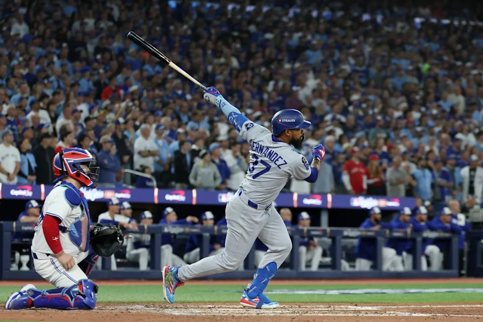 Dodgers right fielder Teoscar Hernandez hits a sacrifice fly to score Dodgers' Will Smith during the World Series.