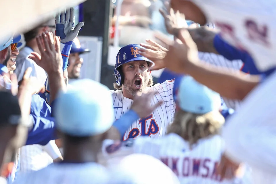 Jul 4, 2025; New York City, New York, USA; New York Mets second baseman Jeff McNeil (1) celebrates in the dugout after hitting a two run home run in the seventh inning against the New York Yankees at Citi Field.