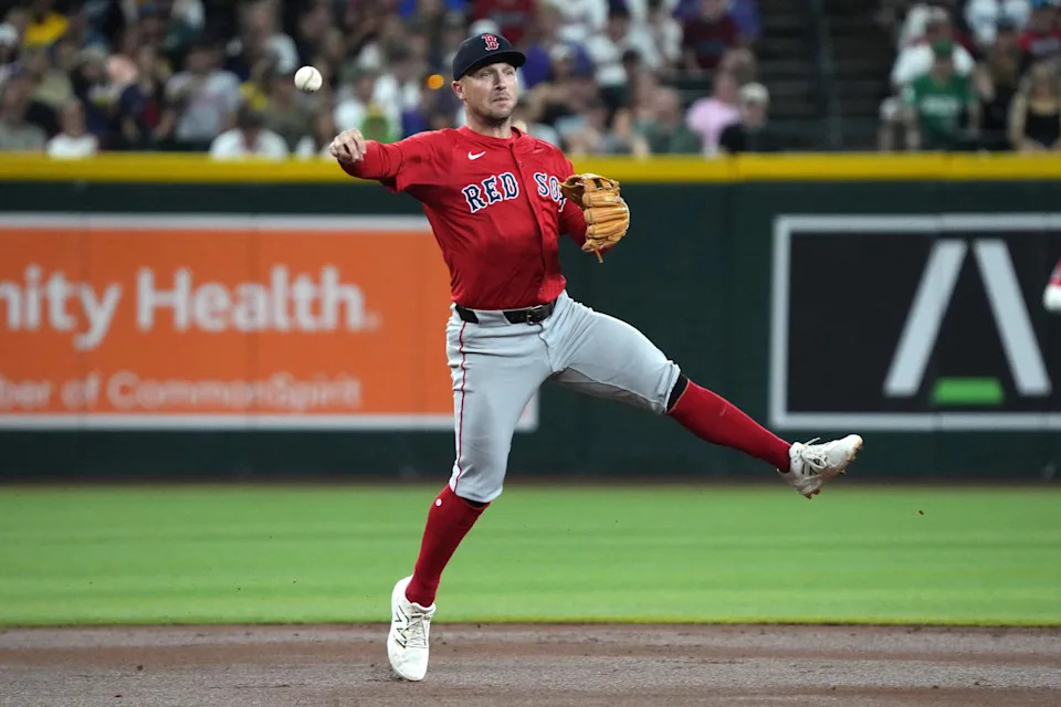 Sep 5, 2025; Phoenix, Arizona, USA; Boston Red Sox third base Alex Bregman (2) mkaes the off balance throw for an out against the Arizona Diamondbacks in the first inning at Chase Field. (Rick Scuteri/Imagn Images)