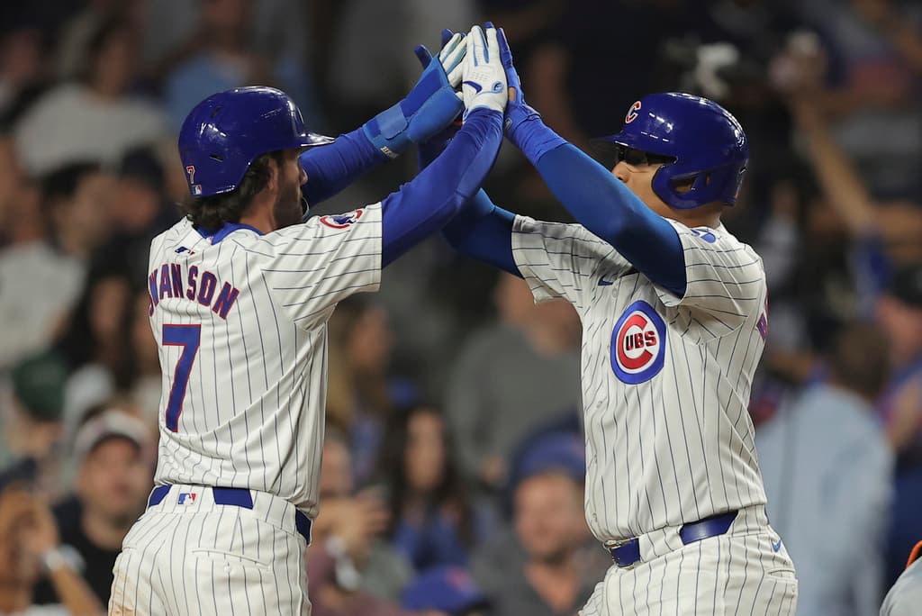 Title: Tigers Cubs Baseball Image ID: 24235055642703 Article: Chicago Cubs' Christian Bethancourt, right, celebrates with Dansby Swanson, left, after hitting a two-run home run during the fifth inning of a baseball game against the Detroit Tigers Wednesday, Aug. 21, 2024, in Chicago. (AP Photo/Melissa Tamez)