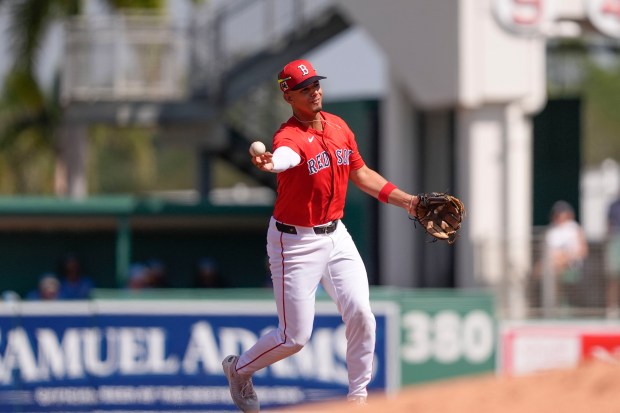 Boston Red Sox second baseman Vaughn Grissom throws to first on a groundout to end the third inning of a spring training game against the Tampa Bay Rays in Fort Myers, Fla., Wednesday, Feb. 26, 2025. (AP Photo/Gerald Herbert)
