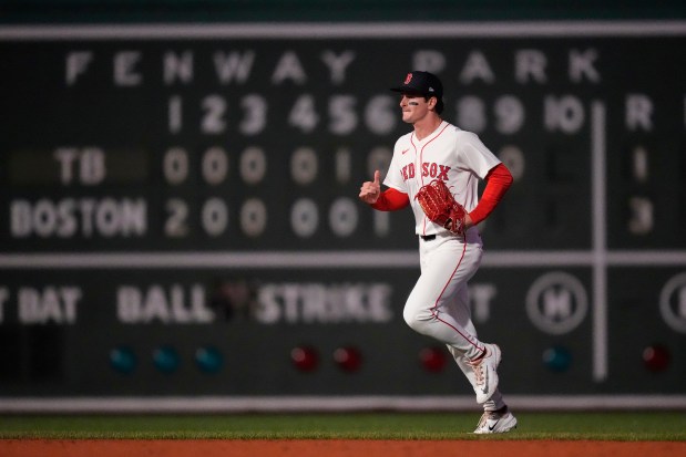 Boston Red Sox outfielder Roman Anthony heads to the dugout after defeating the Tampa Bay Rays in a baseball game at Fenway Park, Tuesday, June 10, 2025, in Boston. (AP Photo/Charles Krupa)