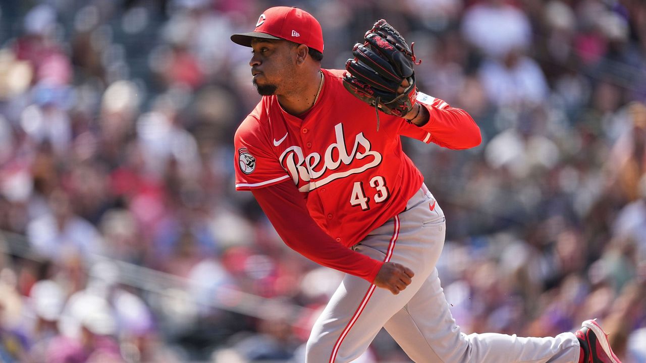 Cincinnati Reds relief pitcher Alexis Díaz throws in the eighth inning of a baseball game, April 26, 2025, in Denver. (AP Photo/David Zalubowski)