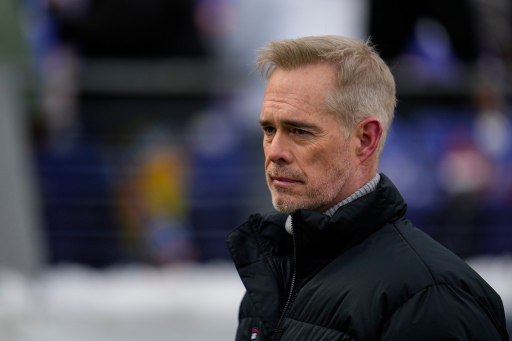 ESPN broadcaster Joe Buck walks the field before an NFL football AFC divisional playoff game between the Baltimore Ravens and the Houston Texans, Jan. 20, 2024, in Baltimore. 