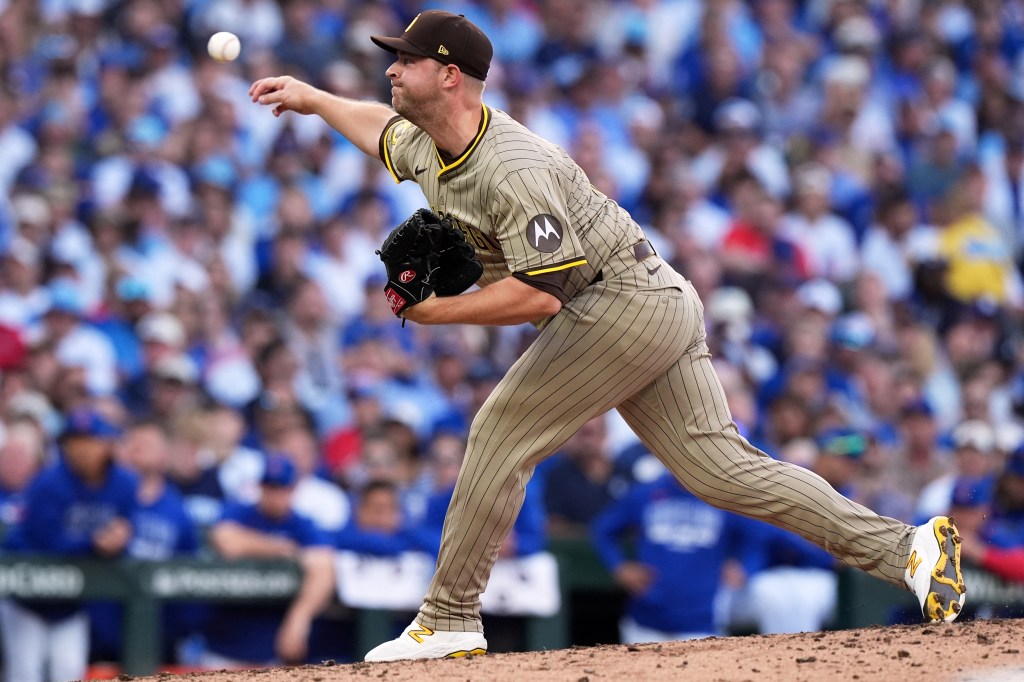 San Diego Padres' Michael King throws during the fourth inning of Game 3 of a National League wild card baseball game against the Chicago Cubs Thursday, Oct. 2, 2025, in Chicago. 