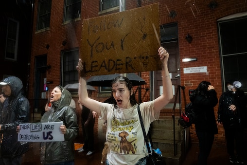 About 250 people gather at the University of Maryland Francis King Carey School of Law to protest Project 2025 author Kevin Roberts giving a talk to law students on Monday, March 31, 2025. Even after rain started to pour, about 50 protesters remained outside the school as the event concluded.