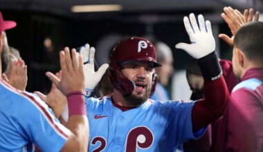 Philadelphia Phillies' Kyle Schwarber reacts after hitting a two-run home run against Atlanta Braves pitcher Austin Cox during the fourth inning of a baseball game Thursday, Aug. 28, 2025, in Philadelphia.
