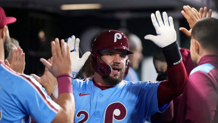 Philadelphia Phillies' Kyle Schwarber reacts after hitting a two-run home run against Atlanta Braves pitcher Austin Cox during the fourth inning of a baseball game Thursday, Aug. 28, 2025, in Philadelphia.