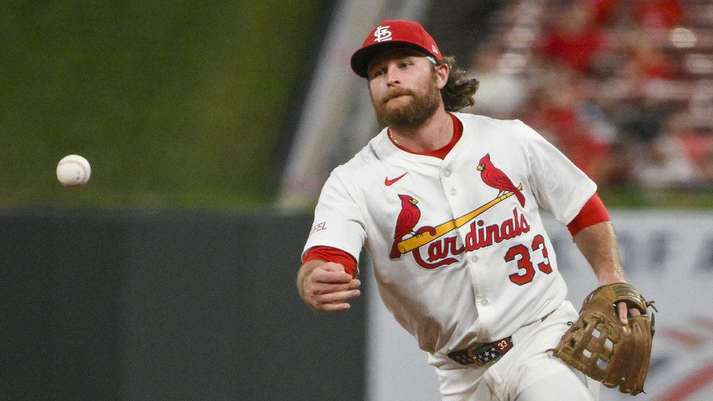 St. Louis Cardinals second baseman Brendan Donovan (33) flips the ball to first base during the ninth inning against the Colorado Rockies at Busch Stadium.