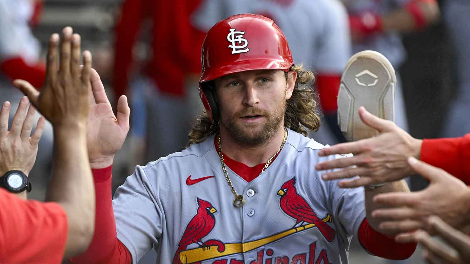 St. Louis Cardinals second baseman Brendan Donovan (33) celebrates in the dugout after he scores during the second inning against the Chicago White Sox at Rate Field.