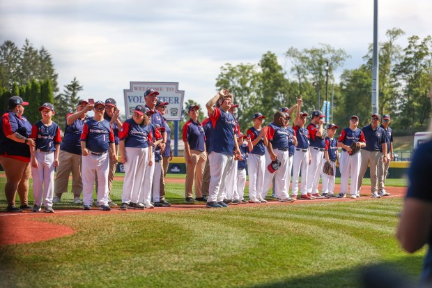 The Wyoming Valley Challenger Baseball team waves to the crowd during the Challenger Baseball championship game in Williamsport on Saturday, Aug. 23, 2024. (JASON ARDAN / STAFF PHOTOGRAPHER)