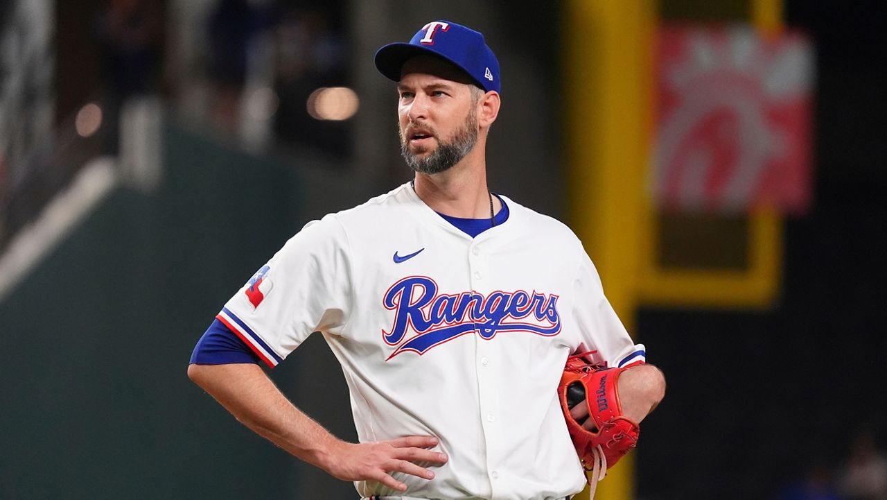 Texas Rangers pitcher Chris Martin stands on the mound just before leaving a baseball game against the Colorado Rockies, May 13, 2025, in Arlington, Texas. (AP Photo/LM Otero)