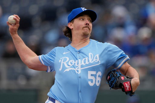 FILE - Kansas City Royals relief pitcher Hunter Harvey throws during the ninth inning of a baseball game against the Cleveland Guardians