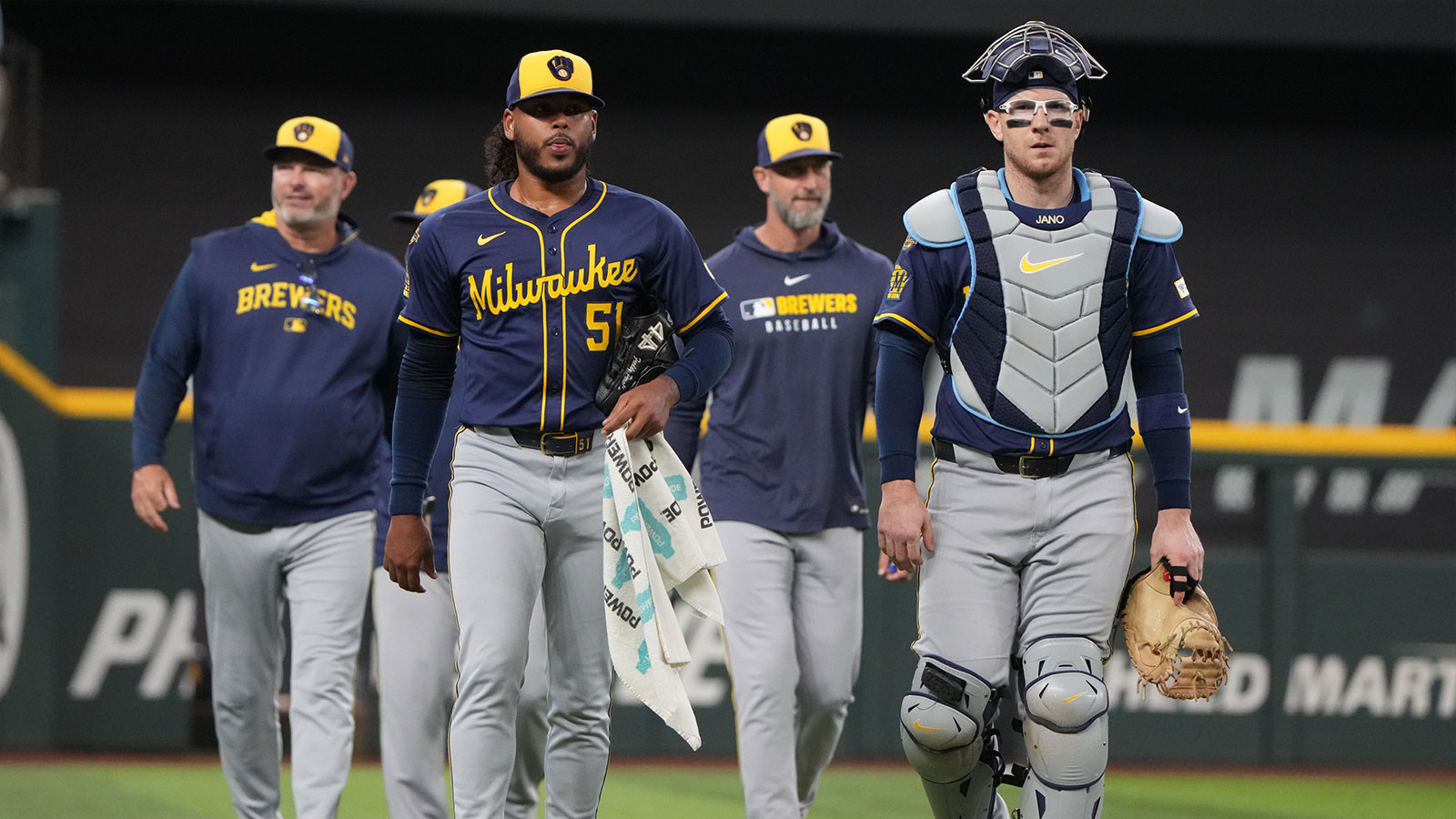 Milwaukee Brewers starting pitcher Freddy Peralta (51) and catcher Danny Jansen (33) walk to the dugout before the first inning against the Texas Rangers at Globe Life Field. 