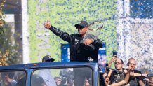 LOS ANGELES, CA - NOVEMBER 03: Manager Dave Roberts #30 of the Los Angeles Dodgers holds up the championship trophy during the Los Angeles Dodgers World Series Championship parade on November 3, 2025 in Los Angeles, California. (Photo by Qian Weizhong/VCG via Getty Images)