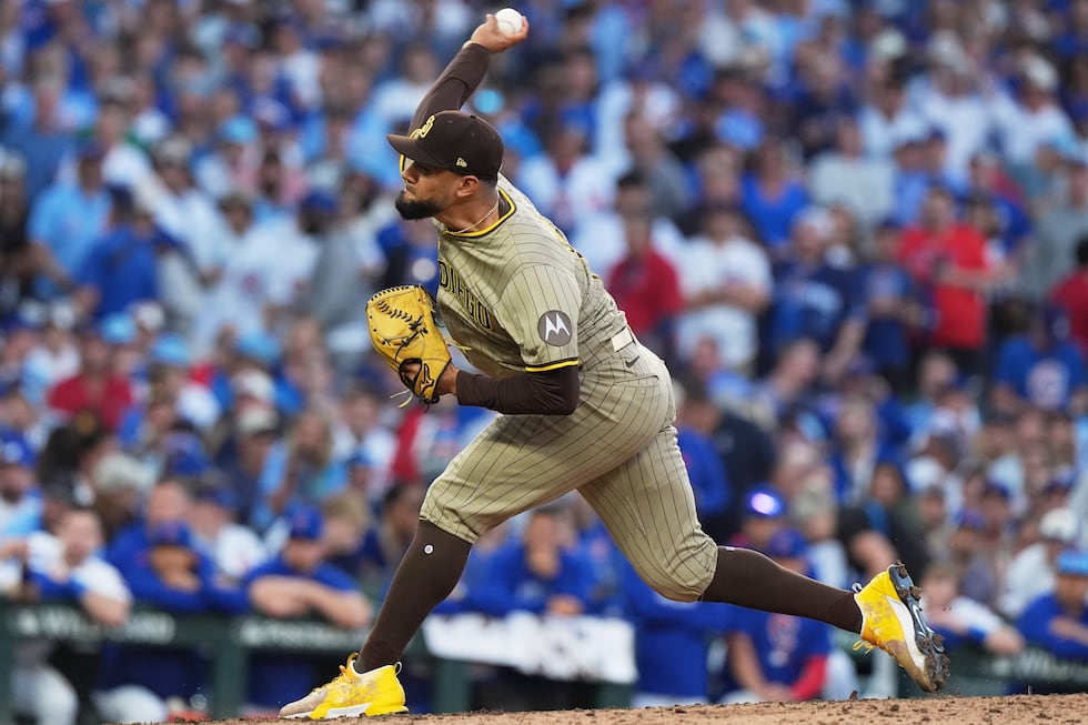 San Diego Padres' Robert Suarez throws the ball during the sixth inning of Game 3 of a...