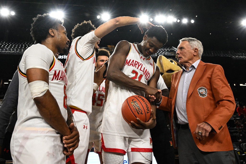 Former Maryland Terrapins head coach Gary Williams, right, hands the MVP game ball to Maryland Terrapins forward Pharrel Payne (21) after an NCAA basketball game against the Coppin State Eagles, Monday, November 3, 2025, at CFG Bank Arena.