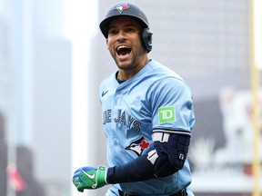 George Springer of the Blue Jays celebrates his go-ahead two run home run against the Twins during the eighth inning at Target Field in Minneapolis, Saturday, June 7, 2025.