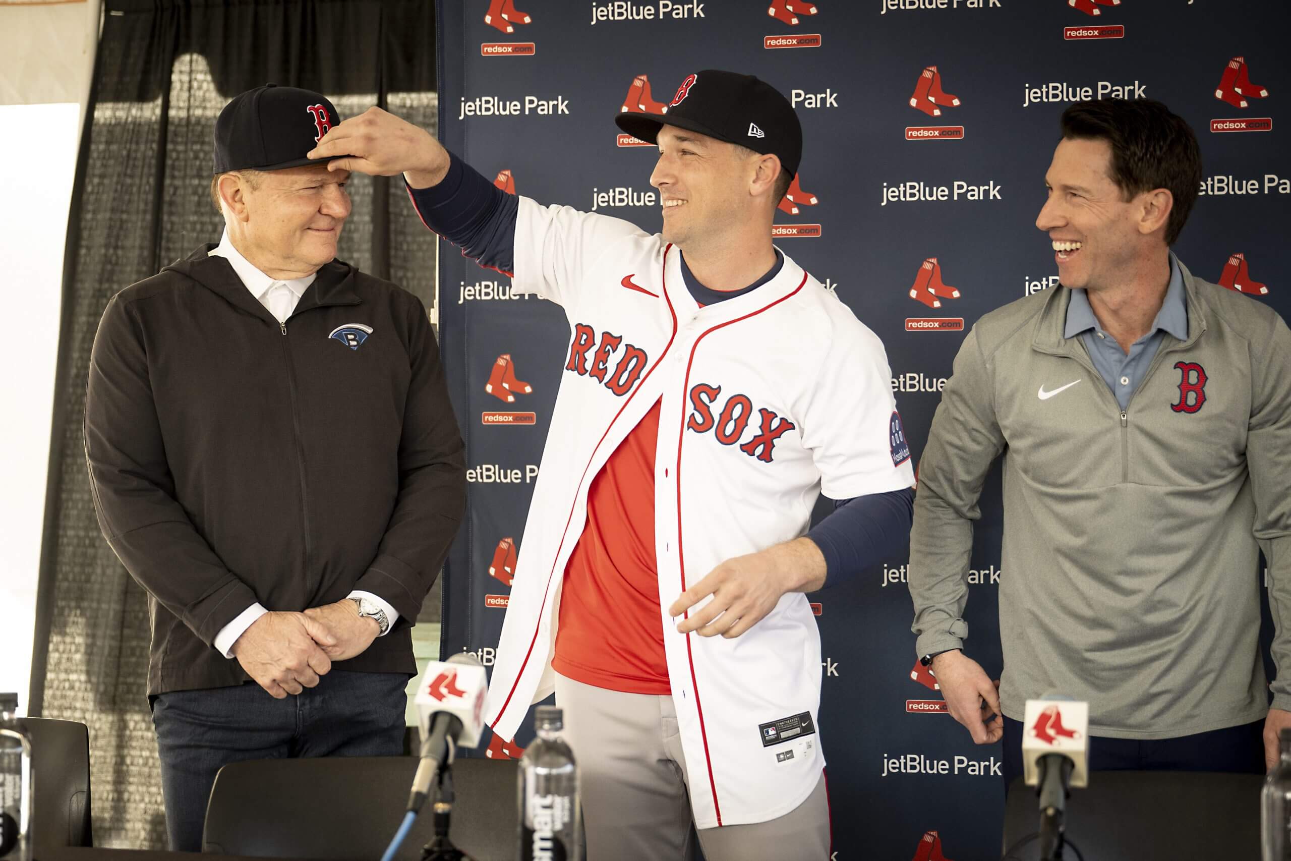  Alex Bregman reacts with agent Scott Boras during his introductory press conference at JetBlue Park at Fenway South in Fort Myers, Florida on February 16, 2025. 