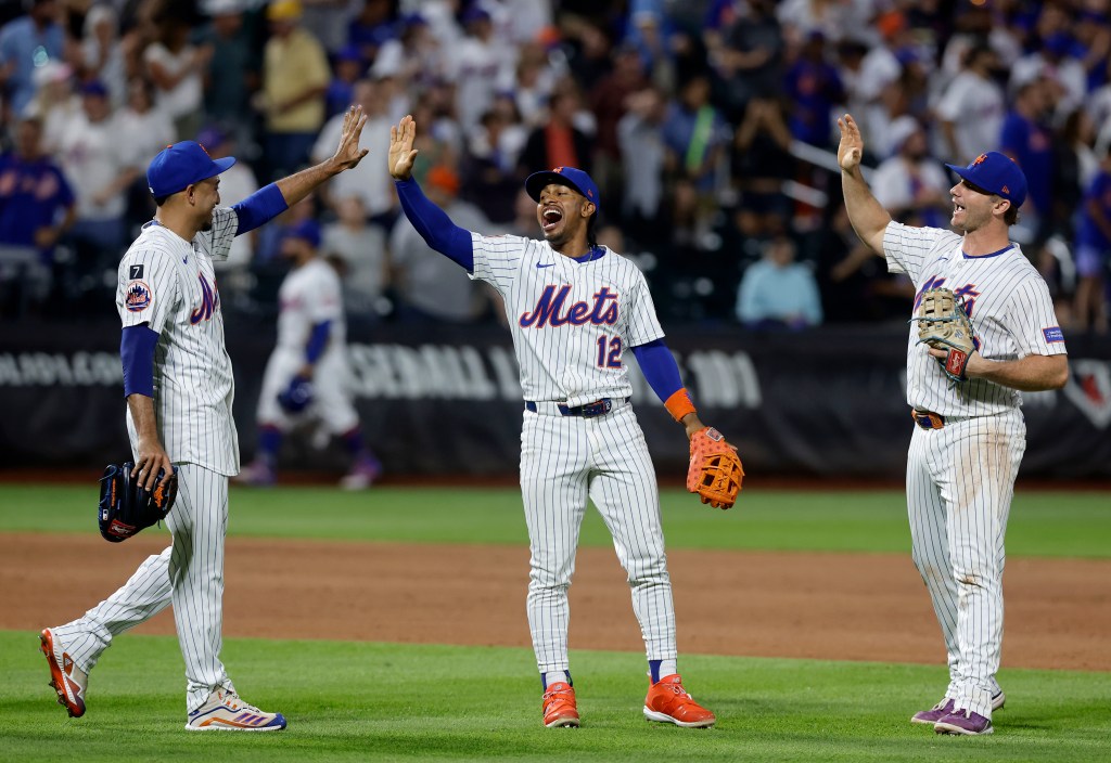 Edwin Diaz #39 (L), Francisco Lindor #12 and Pete Alonso #20 of the New York Mets celebrate after defeating the Milwaukee Brewers at Citi Field on July 03, 2025 in New York City. 