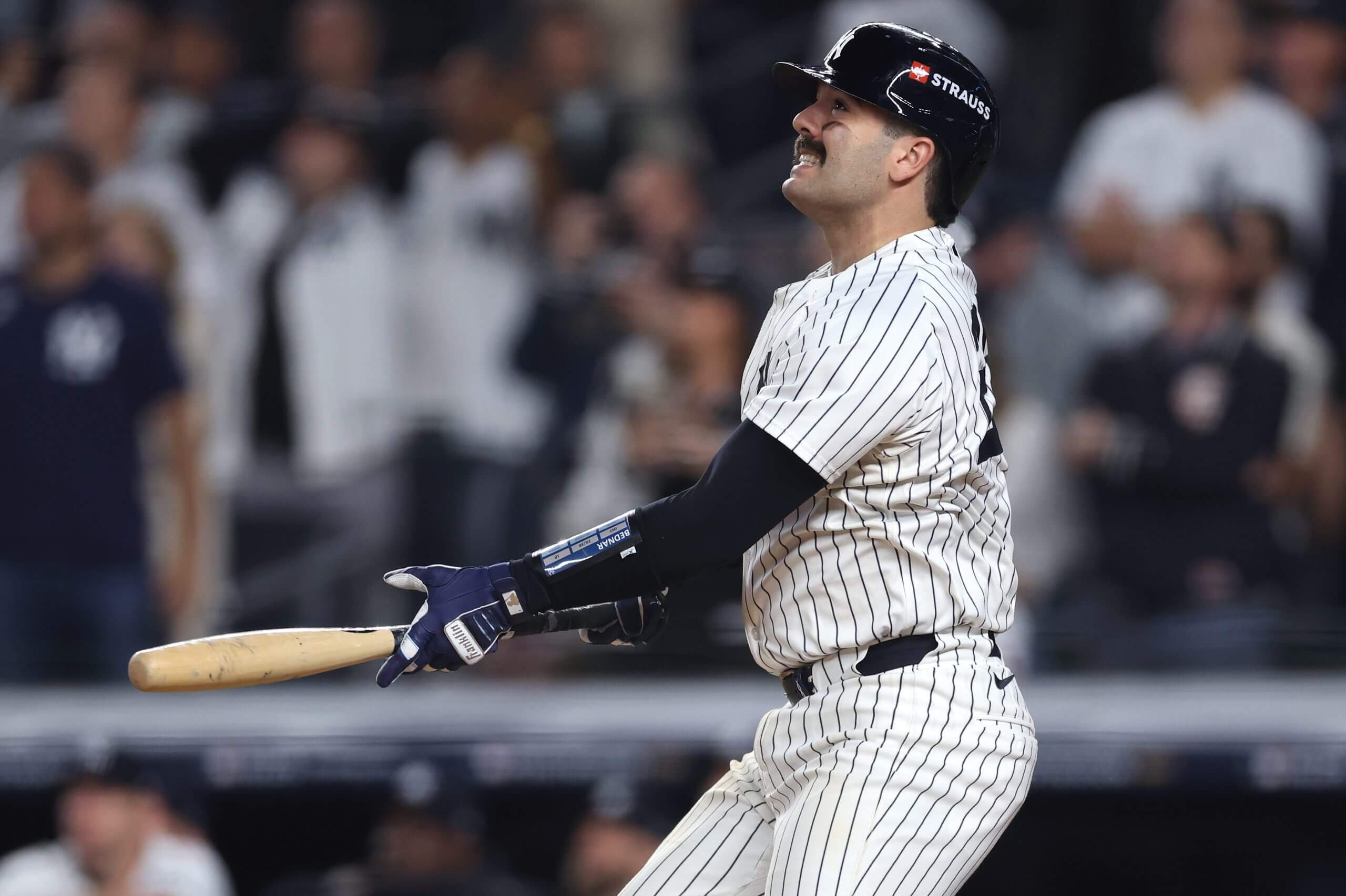 Austin Wells of the New York Yankees holds his bat and winces as he flies out at Yankee Stadium in New York City.