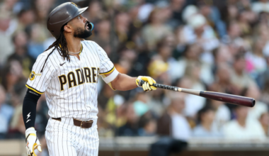 Fernando Tatis Jr. watches a home run during a Padres game as speculation grows over a potential Yankees blockbuster trade.