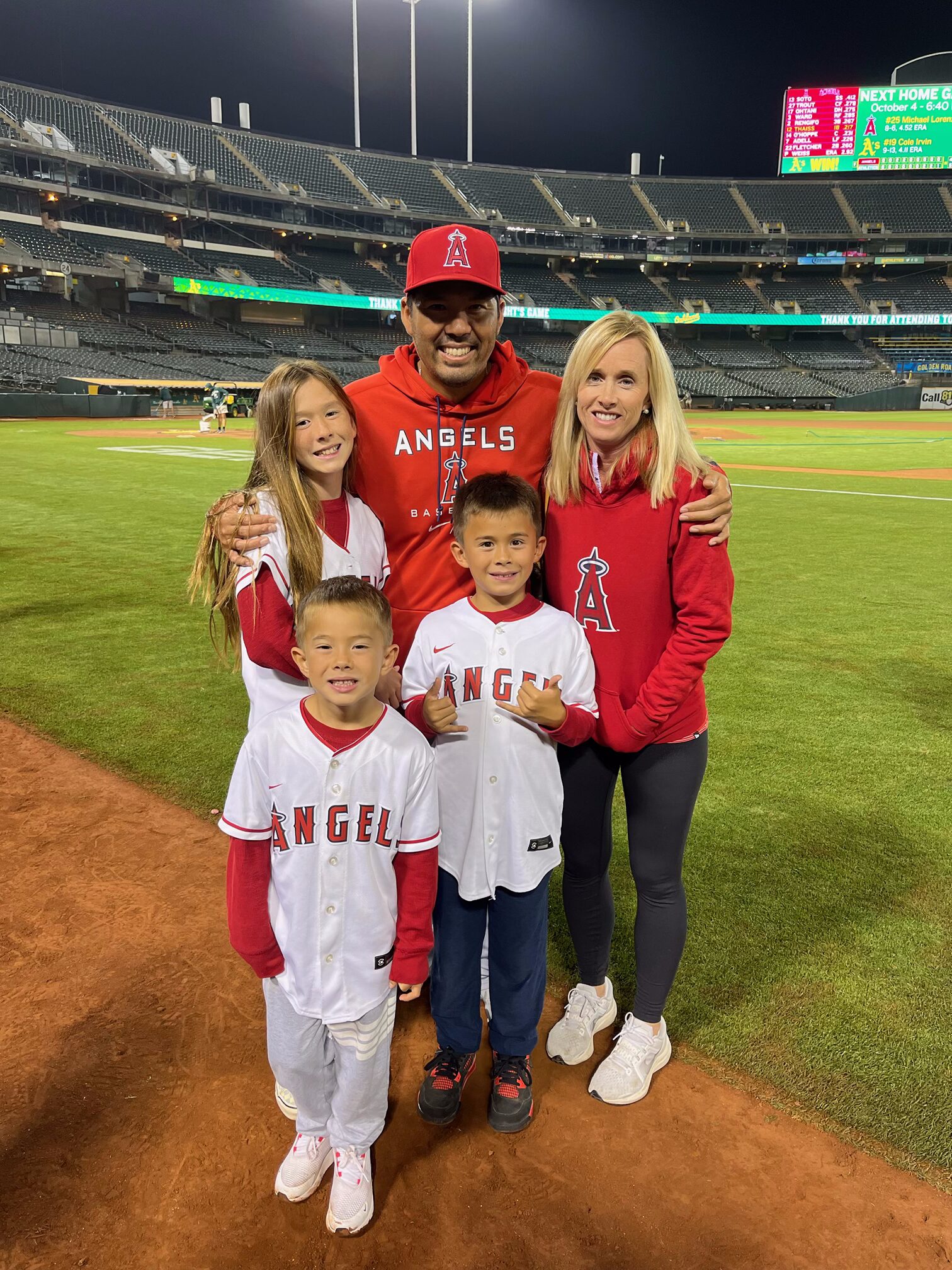 Kurt Suzuki (center back row) stands with his family at one of his final games for the Los Angeles Angels as a player in 2022. From left, Malia Suzuki, Elijah Suzuki, Kainoah Suzuki and mom Renee Suzuki stand with Kurt in this 2022 photo. Photo courtesy of Kimo Higa