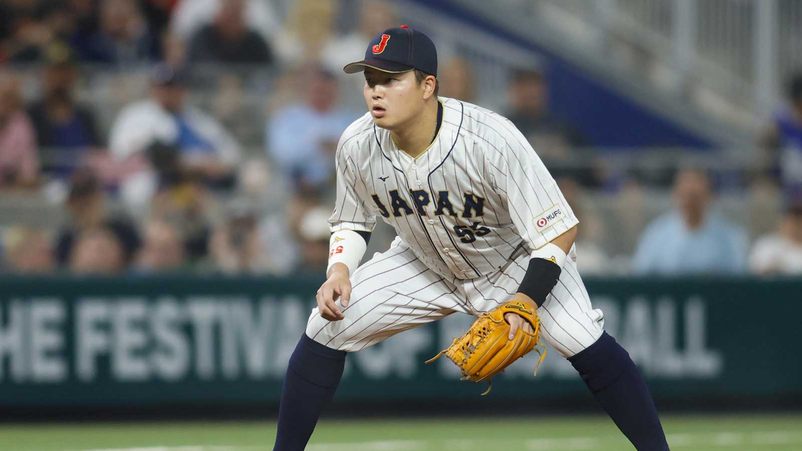 Japan third baseman Munetaka Murakami (55) plays his position during the sixth inning against the USA at LoanDepot Park.